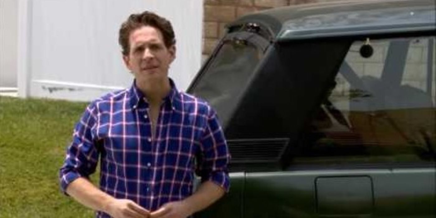 Dennis stands by a car outside on a street in It&rsquo;s Always Sunny in Philadelphia.