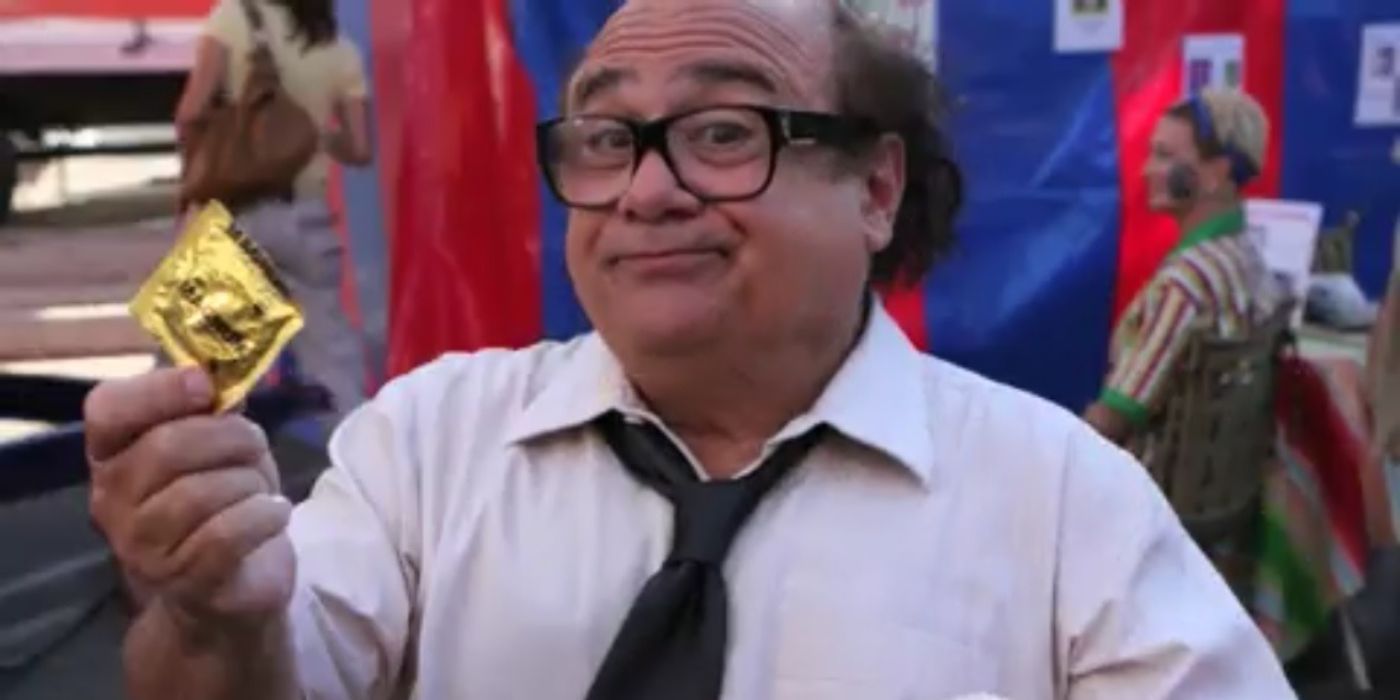 Danny DeVito as Frank holds a condom and looks at the camera in It&rsquo;s Always Sunny in Philadelphia.