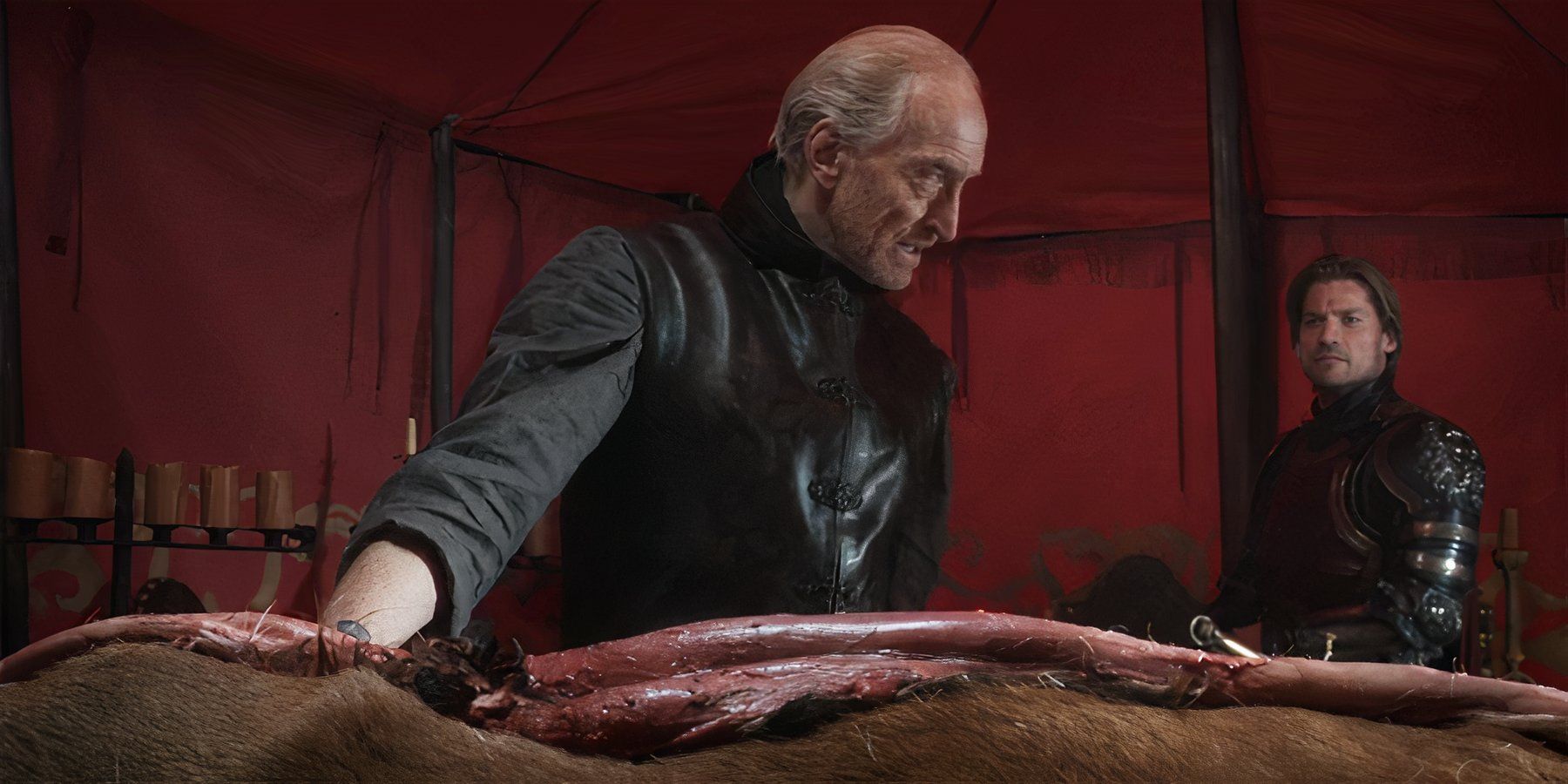 Tywin turns to speak to his son, Jamie, while pausing his act of butchering a stag, in Season 1, Episode 7 of the Game of Thrones series.