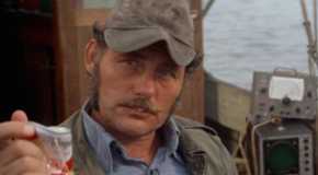 Robert Shaw as Quint, crushing a beer can in his hand in Jaws.