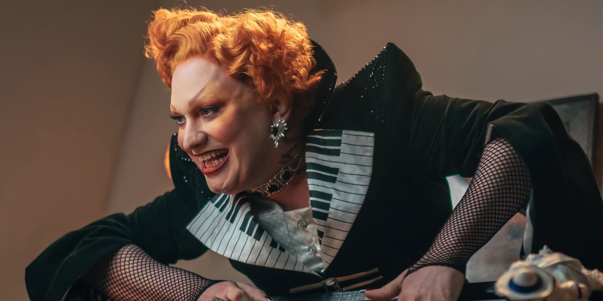Jinkx Monsoon as Maestro climbing out of a piano in Doctor Who.