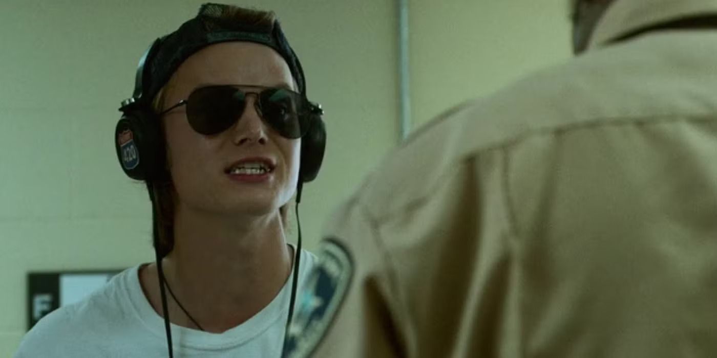 Rudy Pankow as JJ wearing headphones and sunglasses in Outer Banks.