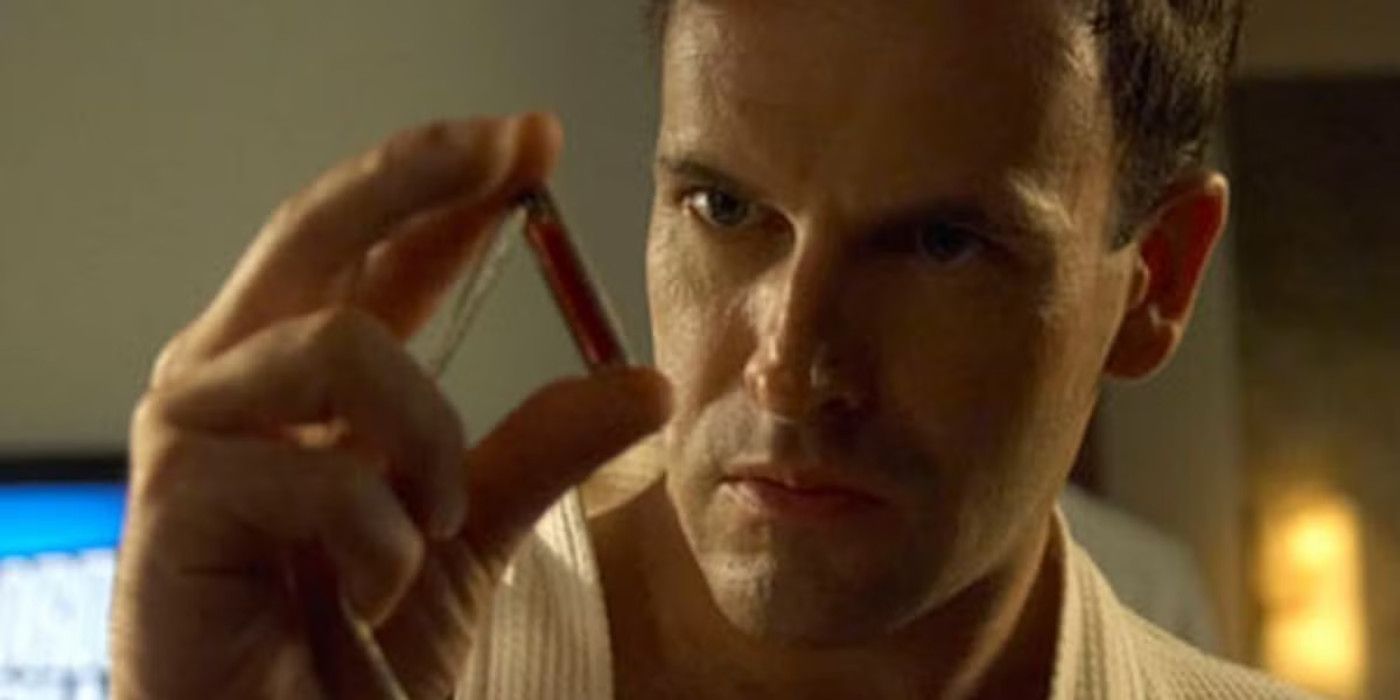 Jordan Chase examines a vial of blood in Dexter.