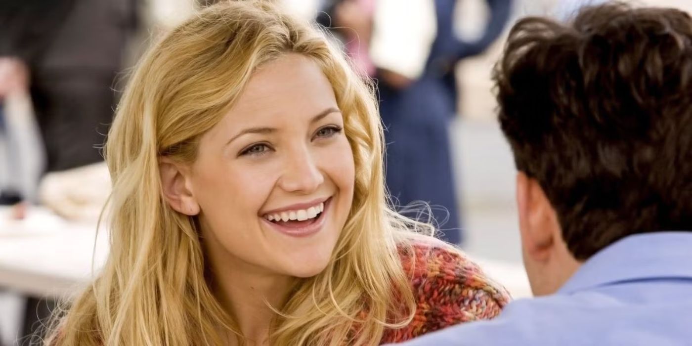 Kate Hudson as Molly, smiling as she sits across from someone in You, Me, and Dupree.