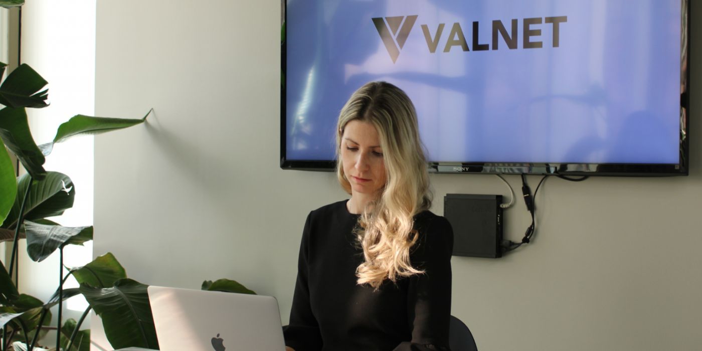 Laura Watson working at the Valnet office.