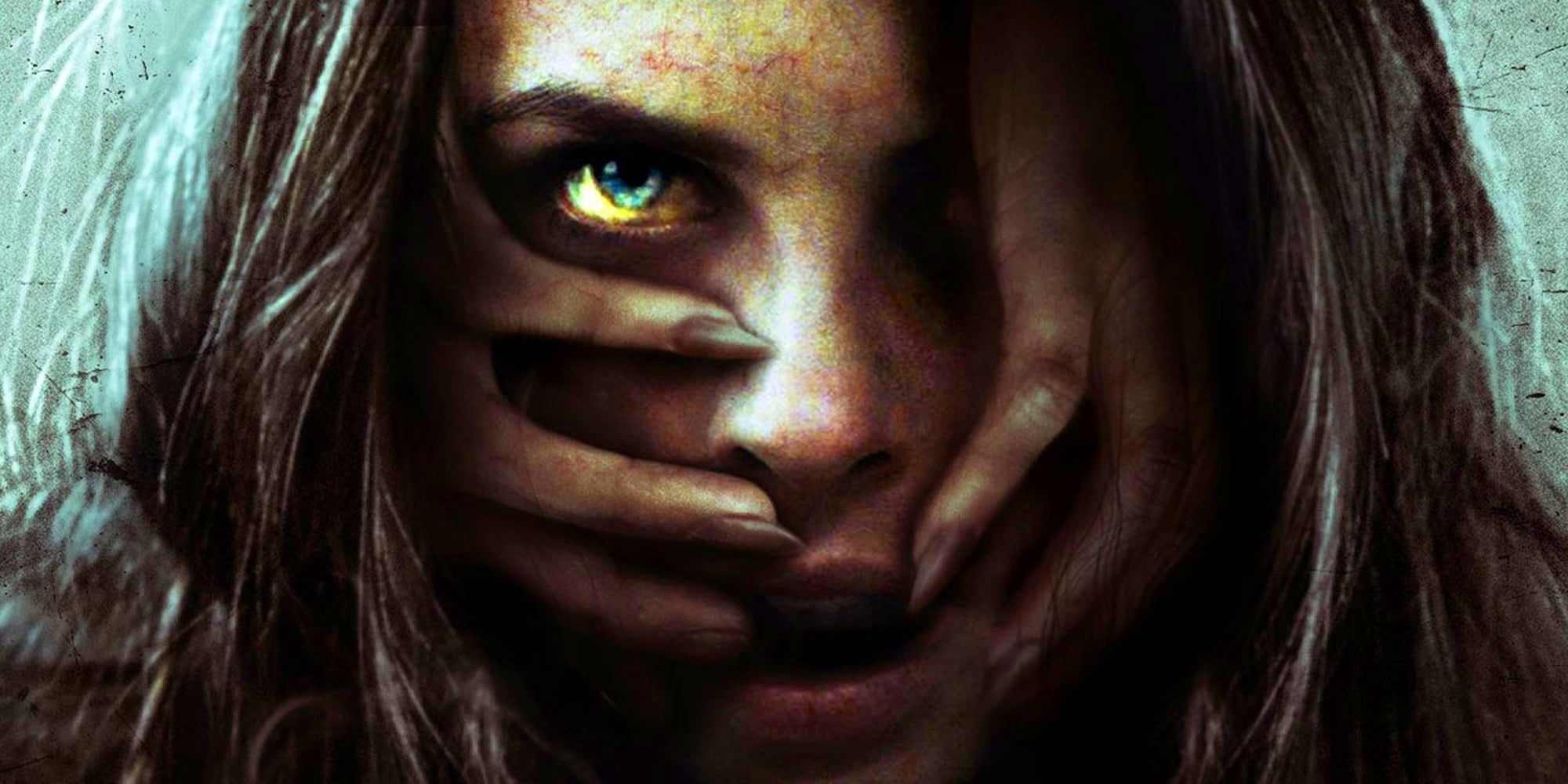 Helen, played by actor Alanna LeVierge, with a pair of hands emerging from under her hair to grip her face in Let Her Out.