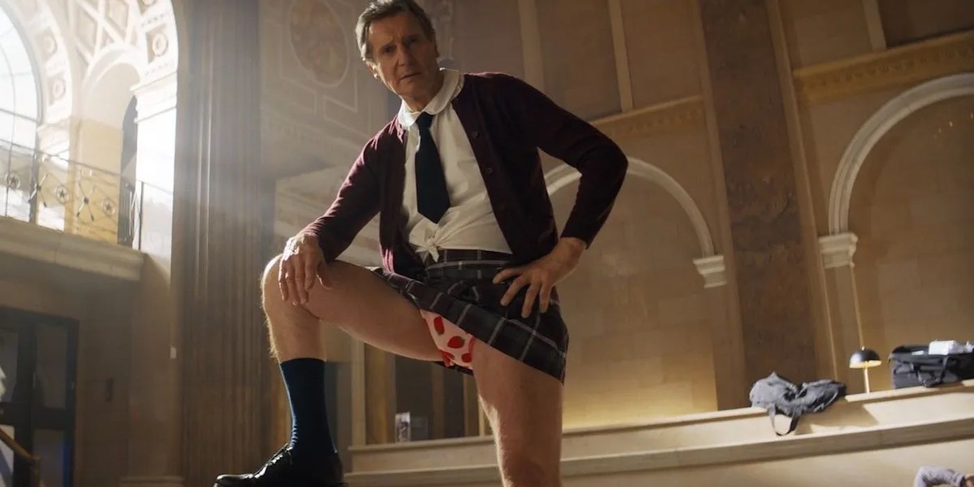 Frank Drebin Jr. (Liam Neeson) in a schoolgirl uniform in The Naked Gun (2025).