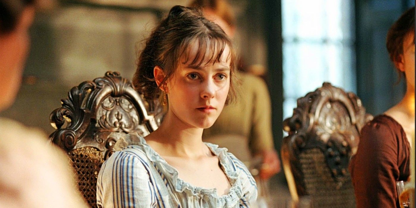 Jena Malone as Lydia Bennet looking sullen at a dinner table in Pride and Prejudice, 2005.