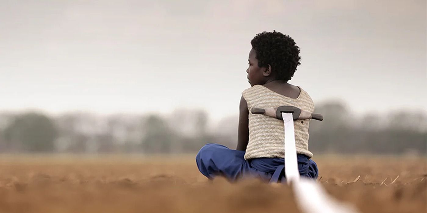 Maggie Mulubwa with a white rope tied to her back in &lsquo;I Am Not a Witch&rsquo;