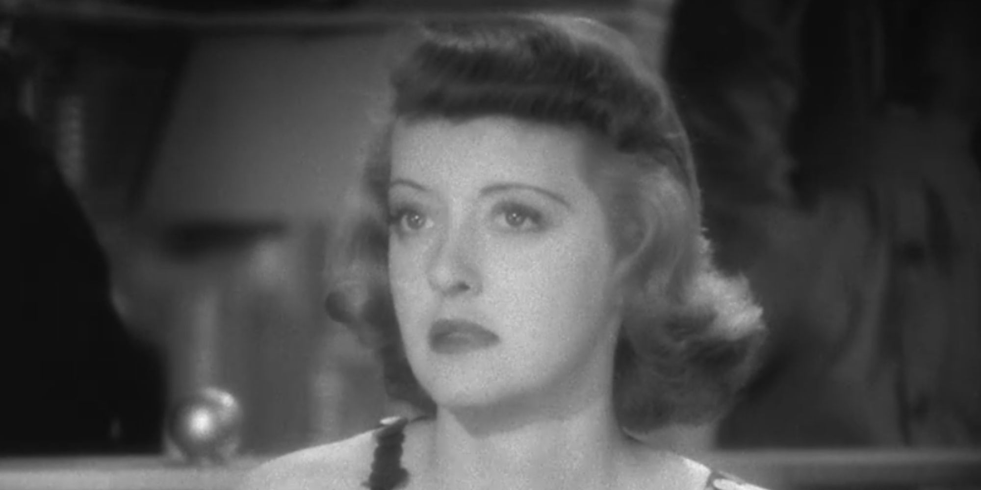 Mary, played by actor Bette Davis, looks startled in Marked Woman.