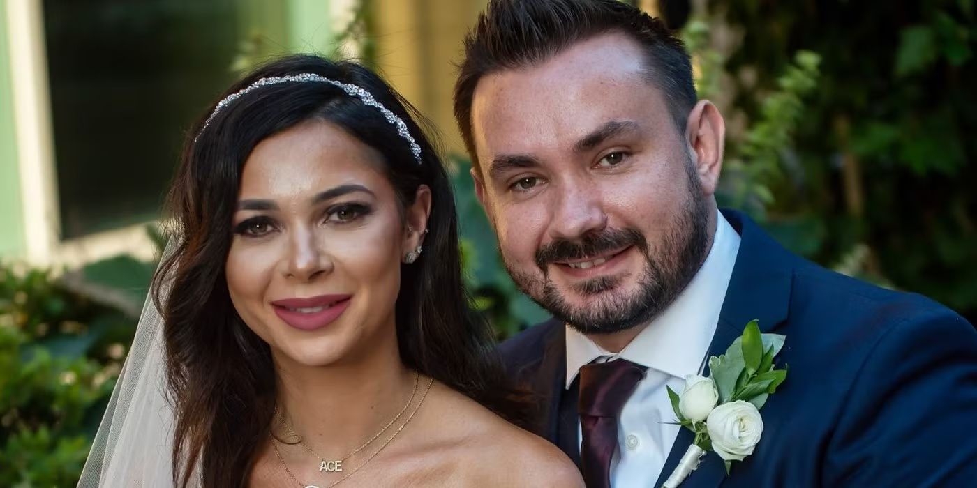 Alyssa and Chris have awkward smiles in their wedding clothes on Season 14 of &lsquo;Married at First Sight.'