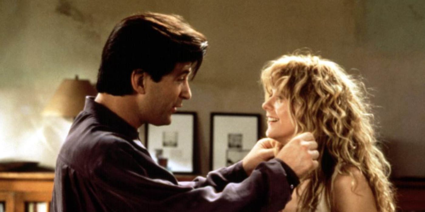 Alec Baldwin and Meg Ryan smile as they face each other in Prelude to a Kiss.