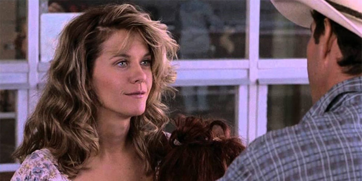 Meg Ryan as Kay Davies looks at Dennis Quaid as Arlis Sweeney in Flesh and Bone.