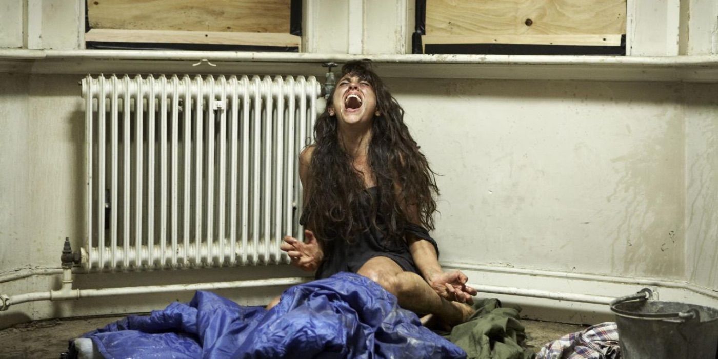 Abby, played by Laura Donnelly, screams and looks up in Dread (2009)