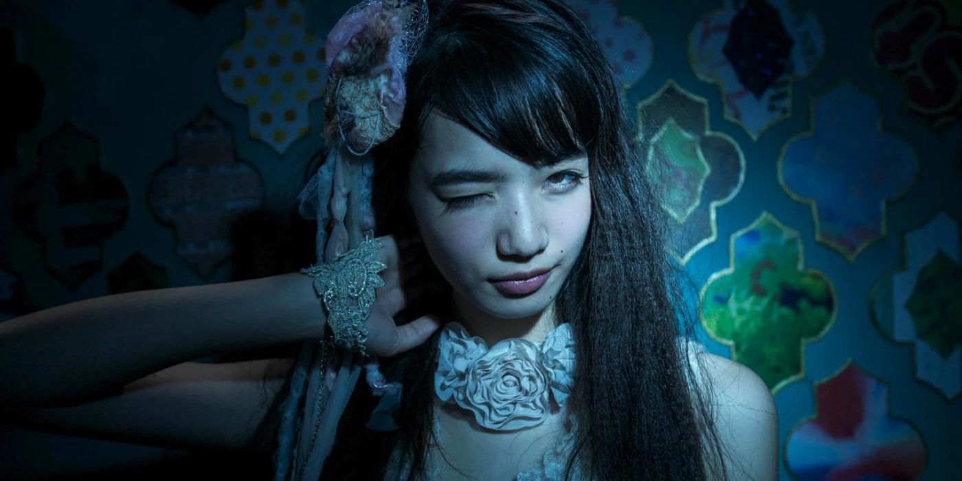 Nana Komatsu as Kanako posing for a picture in The World Of Kanako