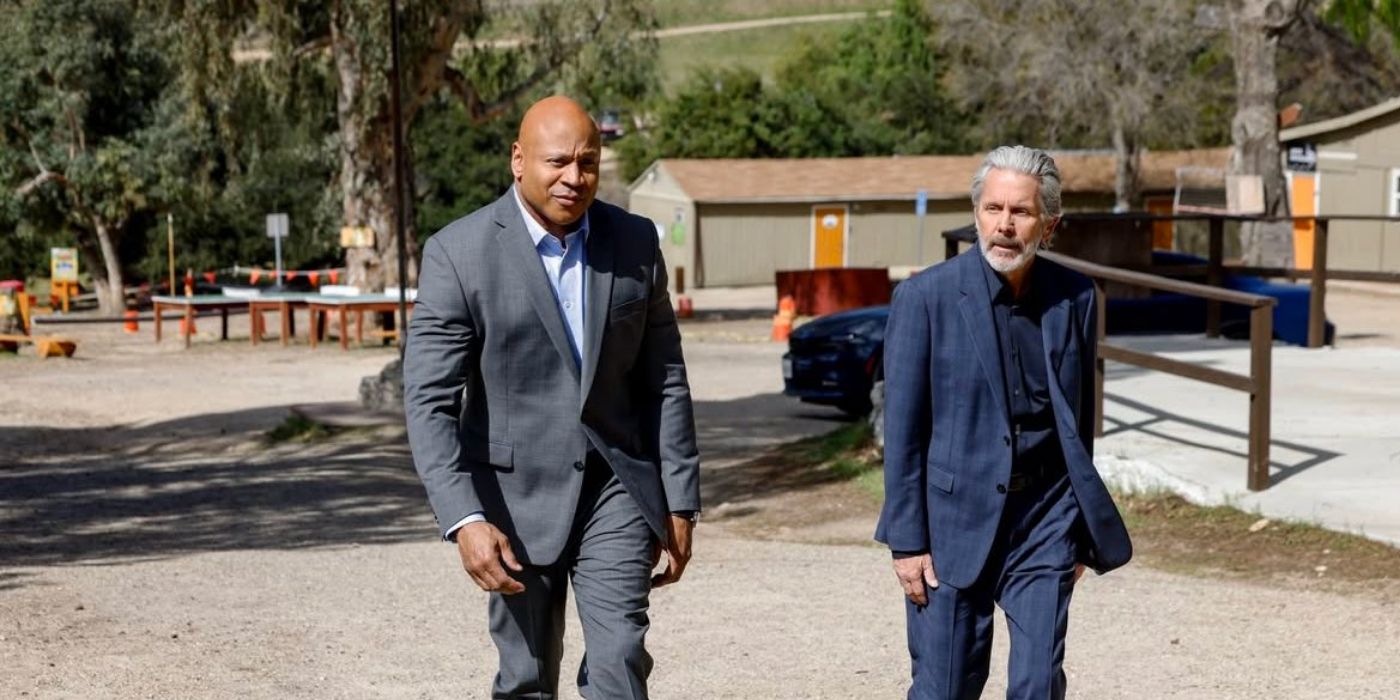 Sam Hanna (LL Cool J) and Alden Parker (Gary Cole) walking in a military training center in NCIS.