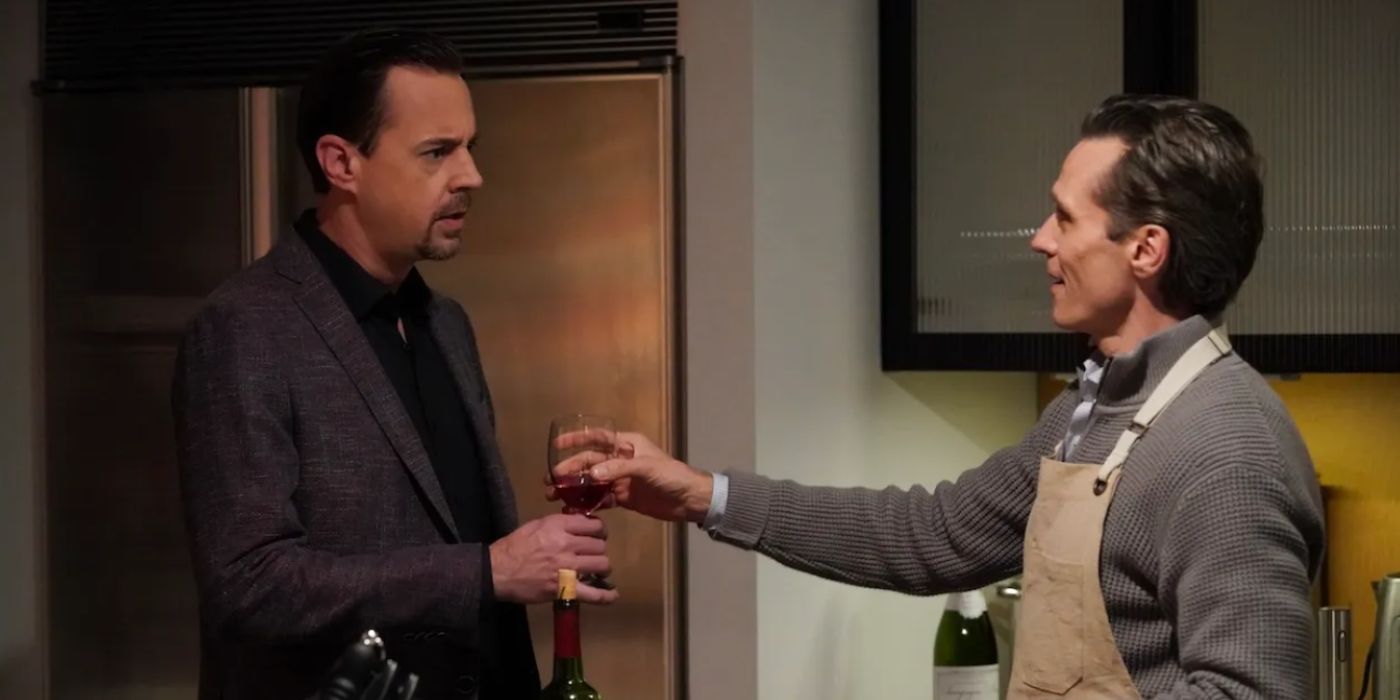 Seamus Dever as LaRoche giving Sean Murray as McGee wine in NCIS Season 22.