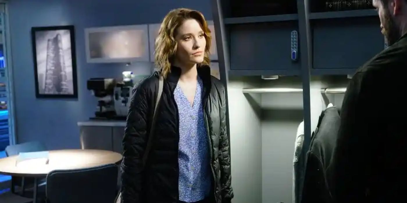 Norma Kuhling as Ava Bekker standing in a locker room looking at someone in Chicago Med Season 4, Episode 22.