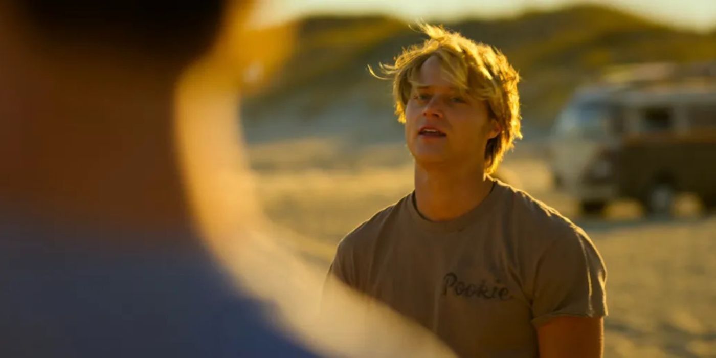 Rudy Pankow as JJ on the beach in Outer Banks.