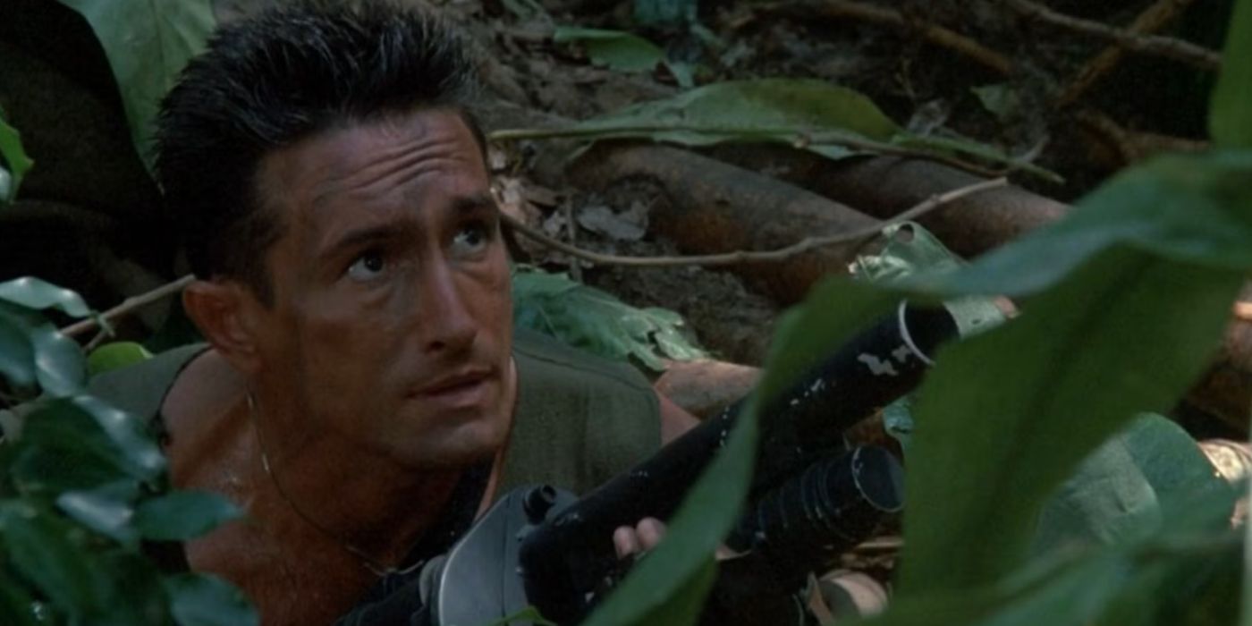 Richard Chaves as Poncho Ramirez sitting in foliage in Predator.