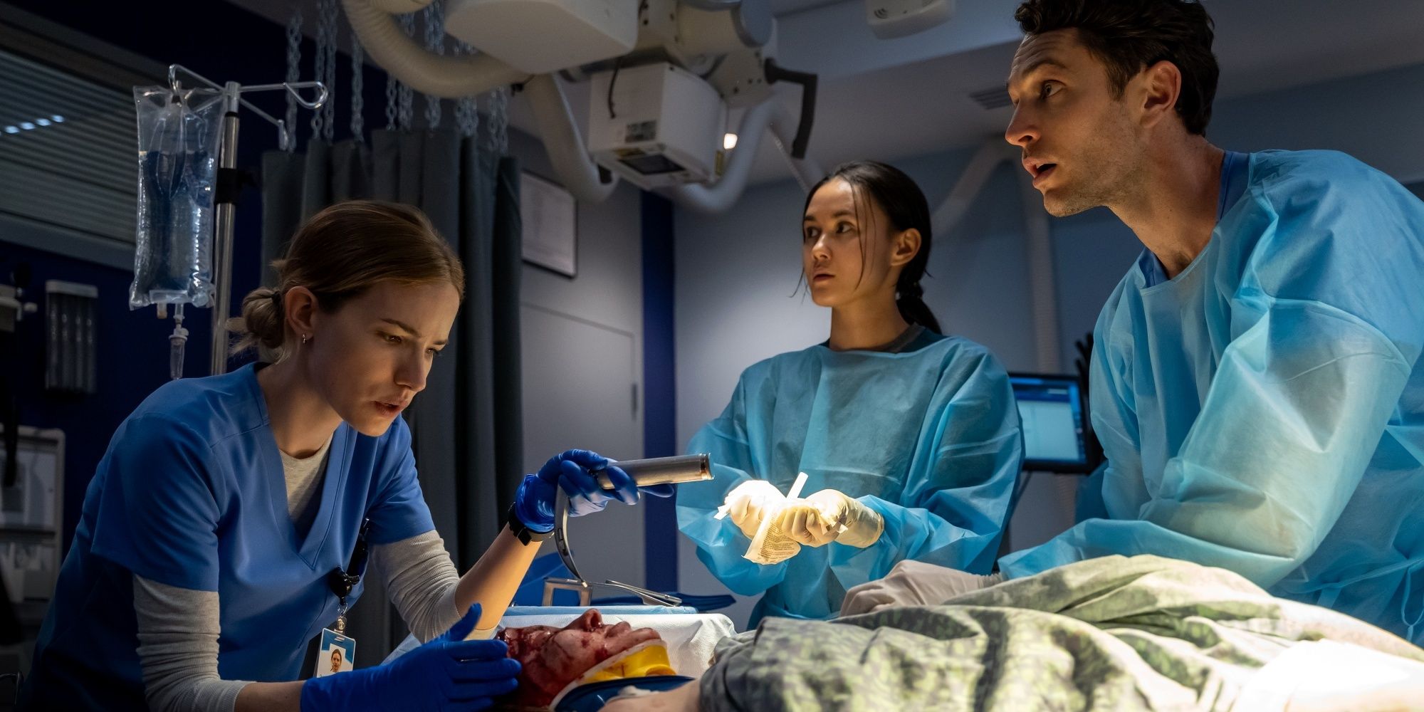 Willa Fitzgerald as Danny in surgery with Colin Woodell and Chealsea Muirhead watching in Pulse