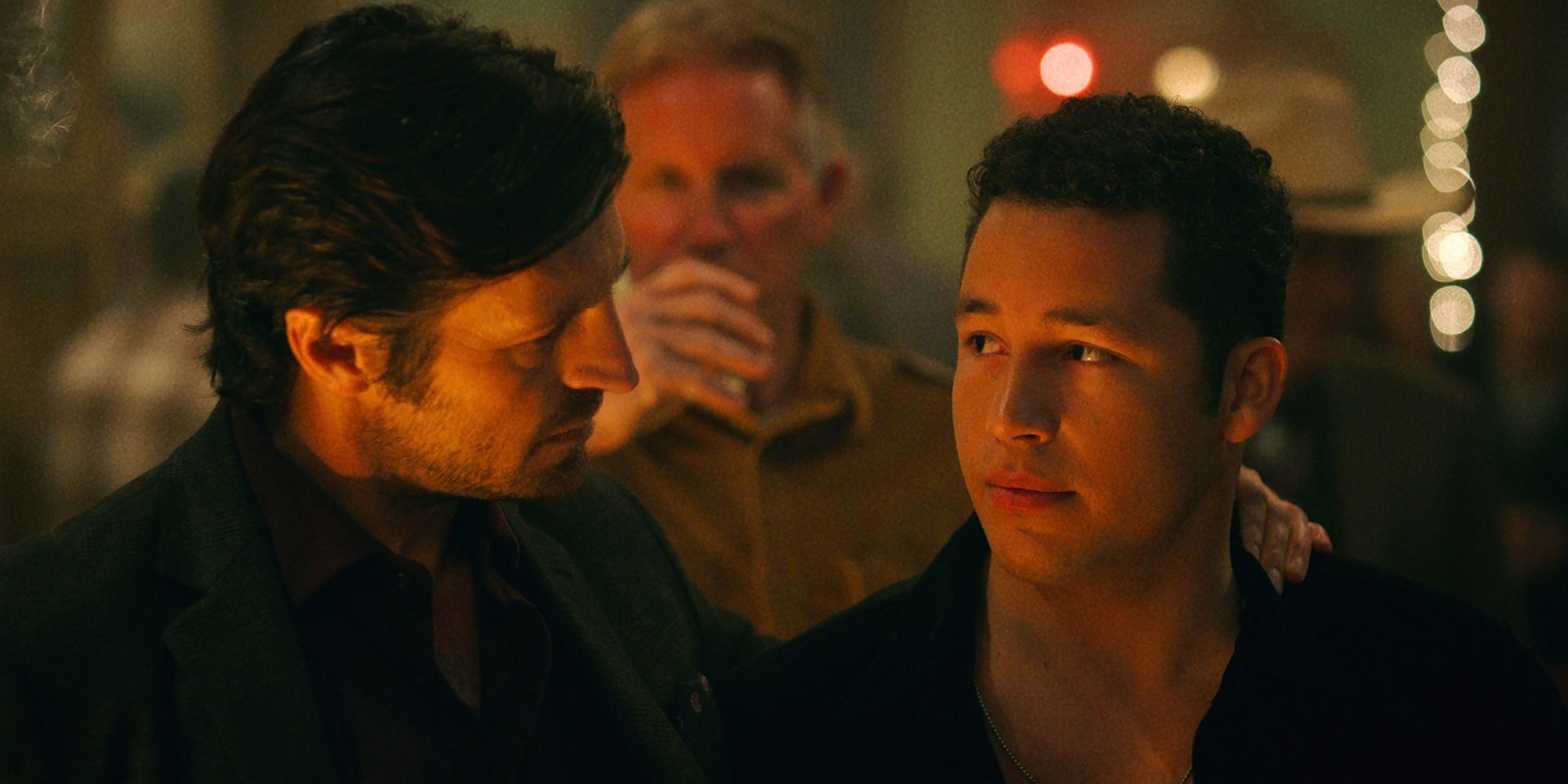 Eoin Macken as Davis Collins with his left hand on the left shoulder of Andrew Liner as Reid in Ransom Canyon