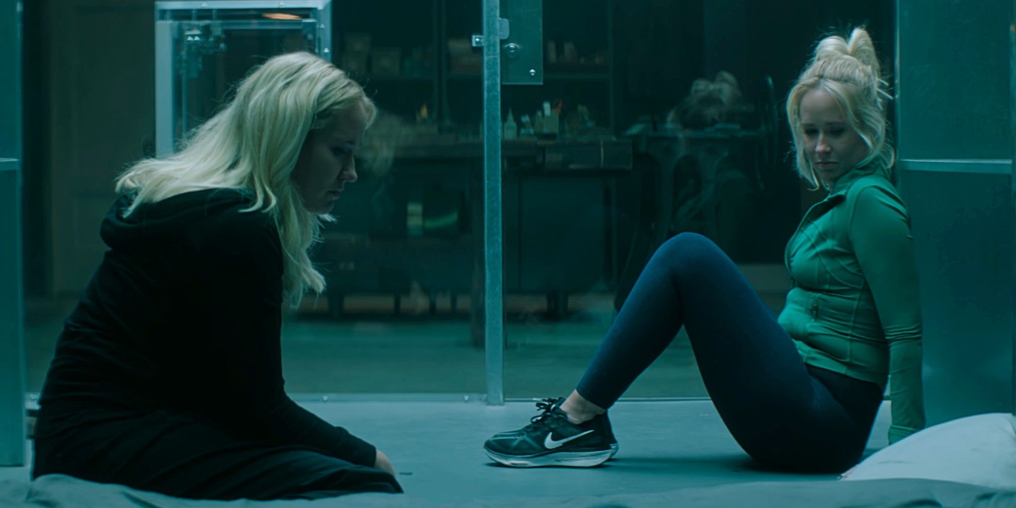MAJOR SPOILERS for You Season 5 - embargoed until 4/24 - Reagan and Maddie (both played by Anna Camp) stuck in the cage together in You Season 5.