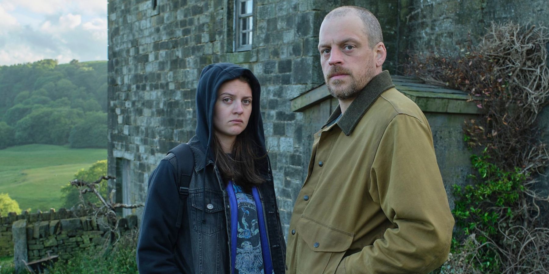 Matthew Gurney and Lara Peake looking down the lens sternly in &lsquo;Reunion&rsquo;