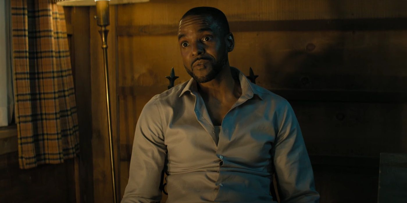 Ronnie Rowe tied to a chair as John Cooper in Reacher Season 3.