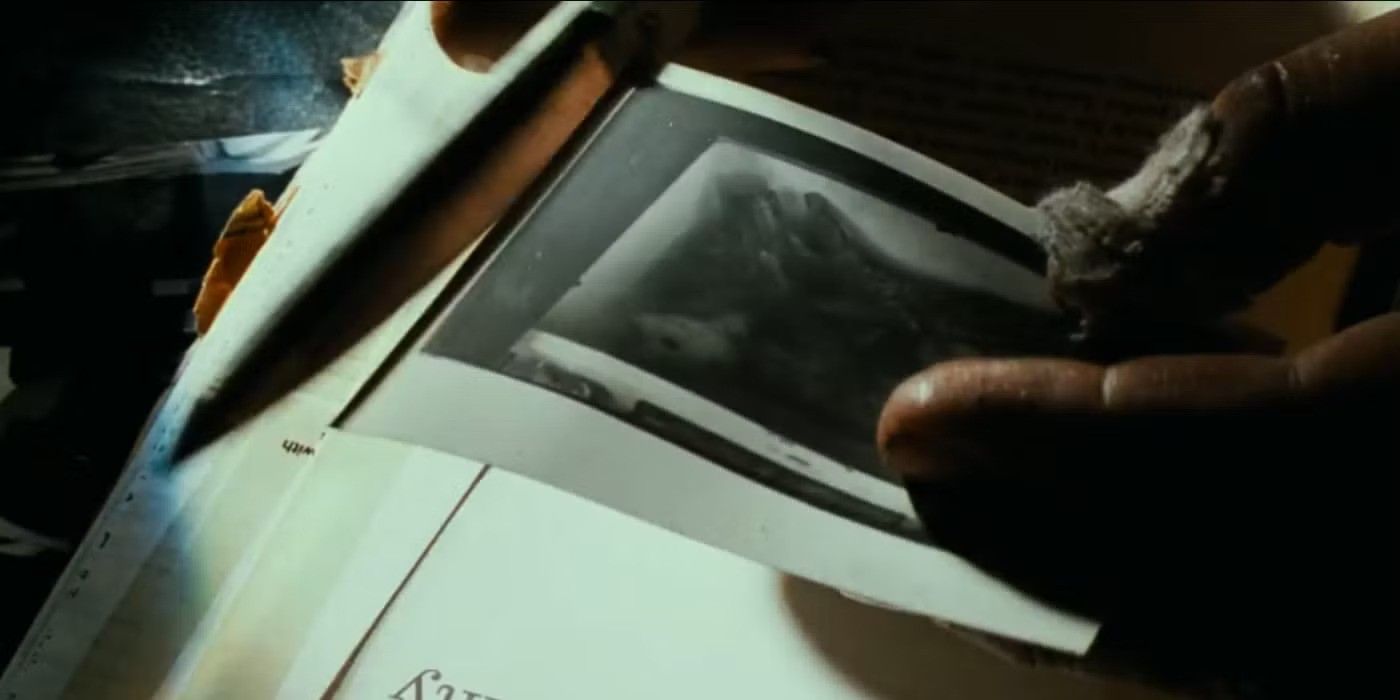 A mysterious man cutting up photographs with scissors in the opening credits for &lsquo;Se7en&rsquo;