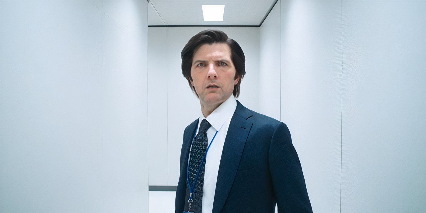 Mark Scout (Adam Scott) stands in an all-white hallway looking unpleasantly shocked in Severance.