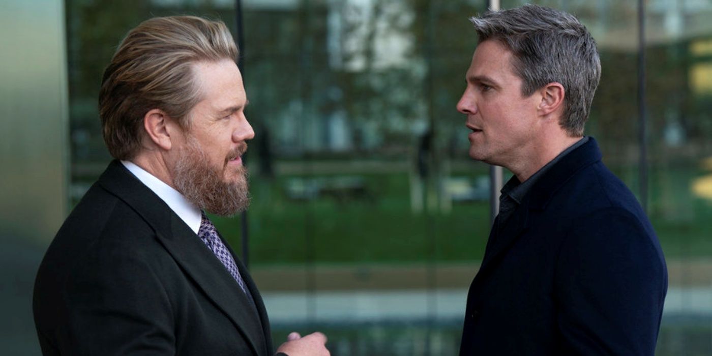 Josh McDermitt as Stuart Lane standing across from Stephen Amell as Ted Black in Suits LA