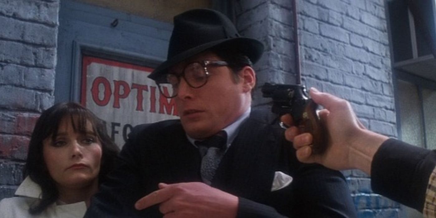 A gun pointed at Clark Kent and Lois Lane in Superman