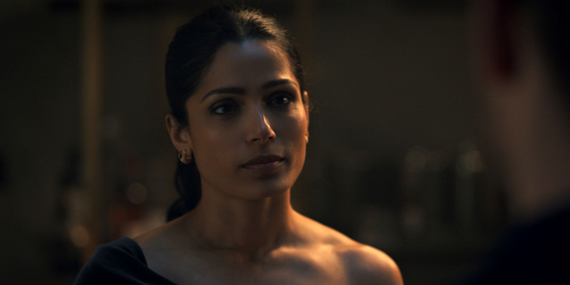 Freida Pinto as Grace looking serious in Season 2 of Surface