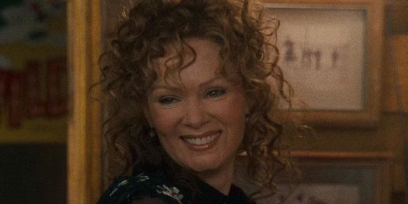 Jean Smart with curly hair smiling in Sweet Home Alabama.