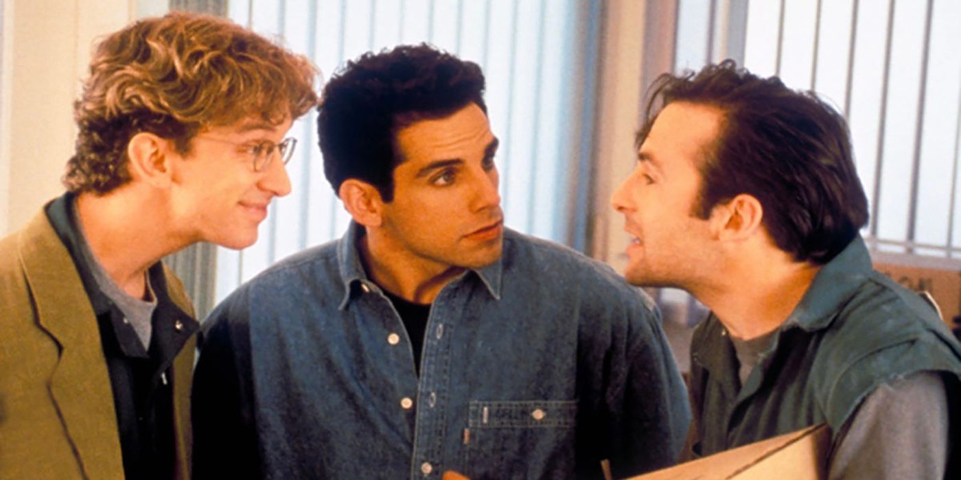 Three men huddled together talking in The Ben Stiller Show.