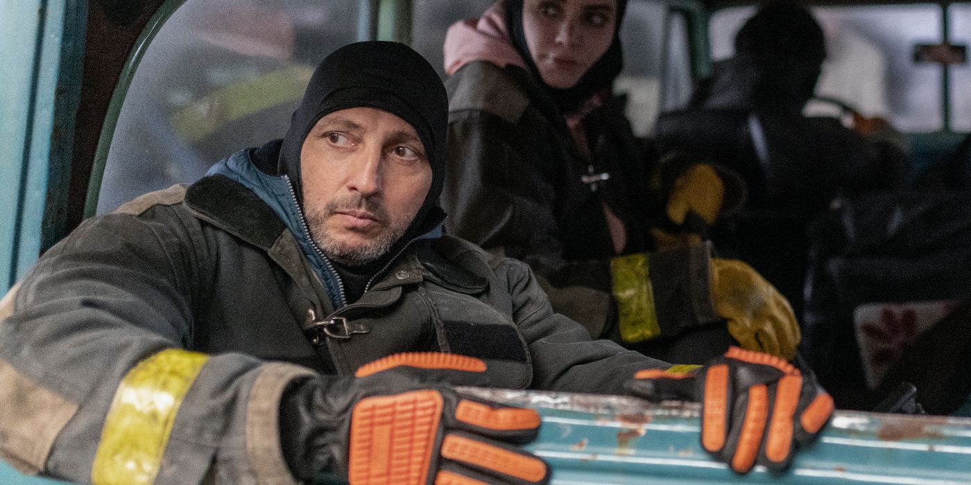 Ariel Staltari in Netflix's The Eternaut in tactile gear sitting in a vehicle and looking out.