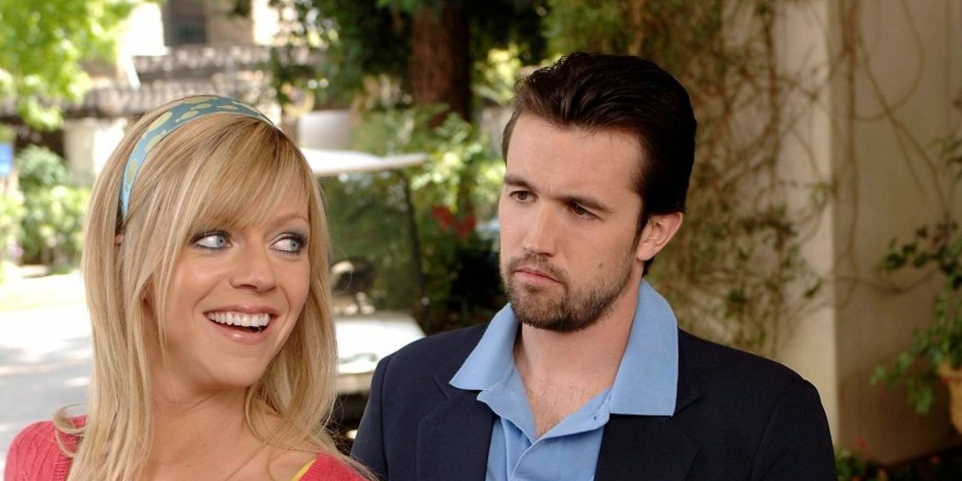 Mac looks disapprovingly at Dee who is smiling in It&rsquo;s Always Sunny in Philadelphia.