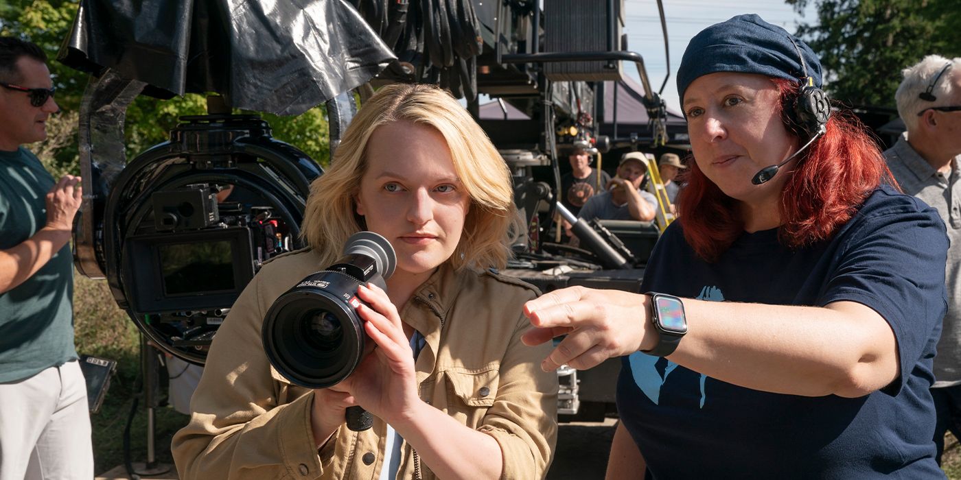 Elisabeth Moss holding a camera and talking with DP Nicola Daley on the set of The Handmaid&rsquo;s Tale