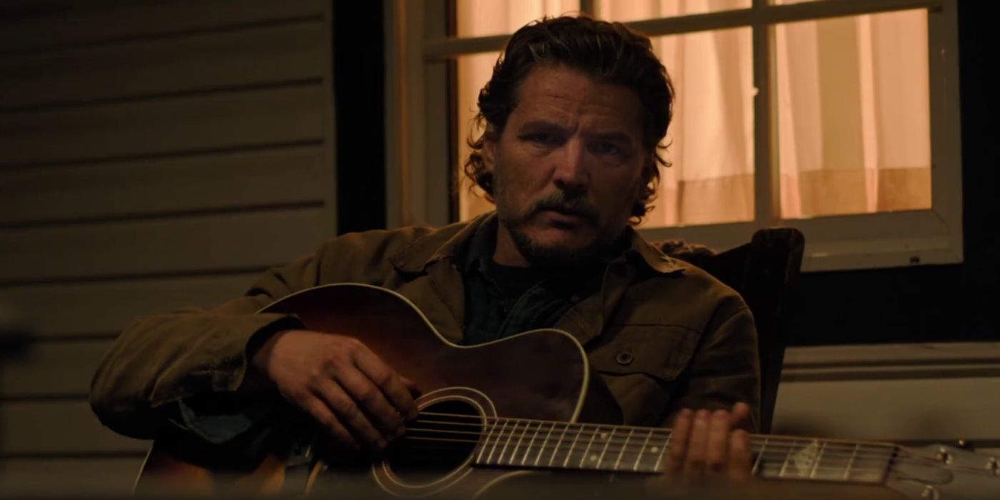 Joel (Pedro Pascal) plays the guitar on his porch in The Last of Us