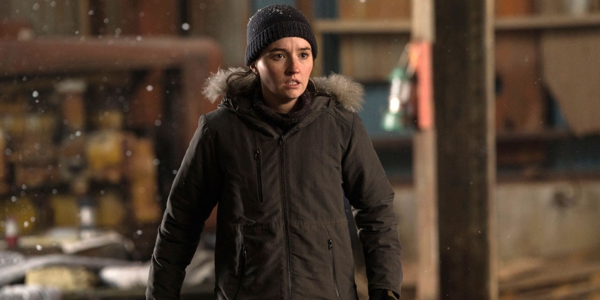 Kaitlyn Dever as Abby in a hooded coat lined with fur and a knit cap in The Last of Us Season 2