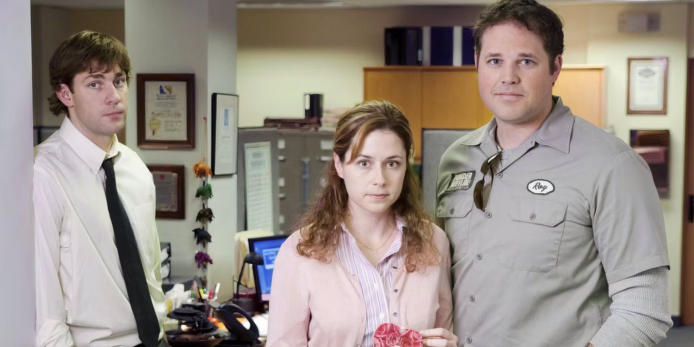 The Office's Pam and Roy standing close to each other while Jim stands in the corner.