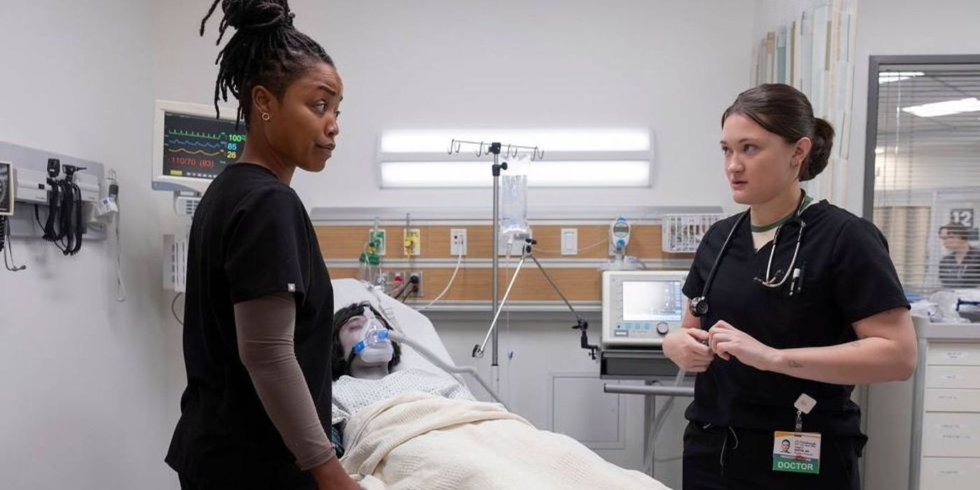 Dr. Ellis (Ayesha Harris) and Dr. Santos (Isa Briones) in black scrubs, stand next to a patient with blue skin in &lsquo;The Pitt&rsquo;