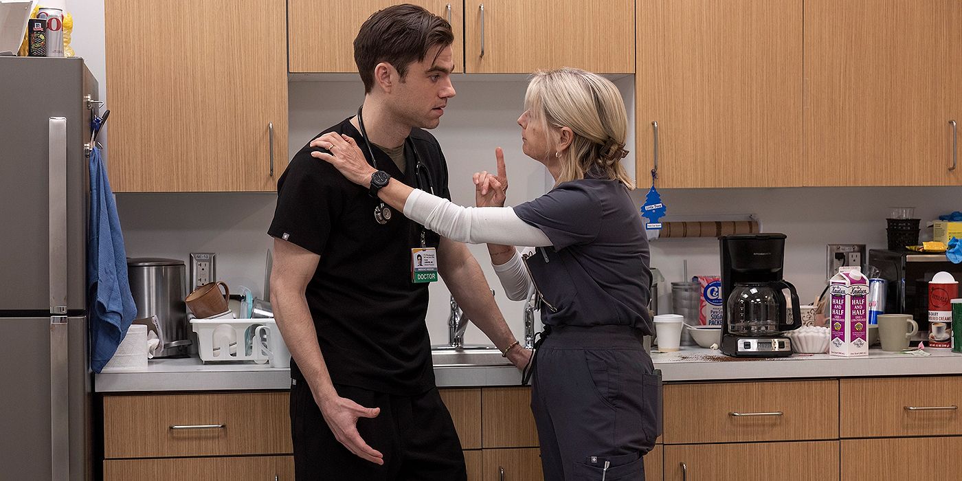 Katherine LaNasa as Nurse Dana pointing and talking to Patrick Ball as Dr. Langdon seriously in The Pitt Season 1, Episode 15.