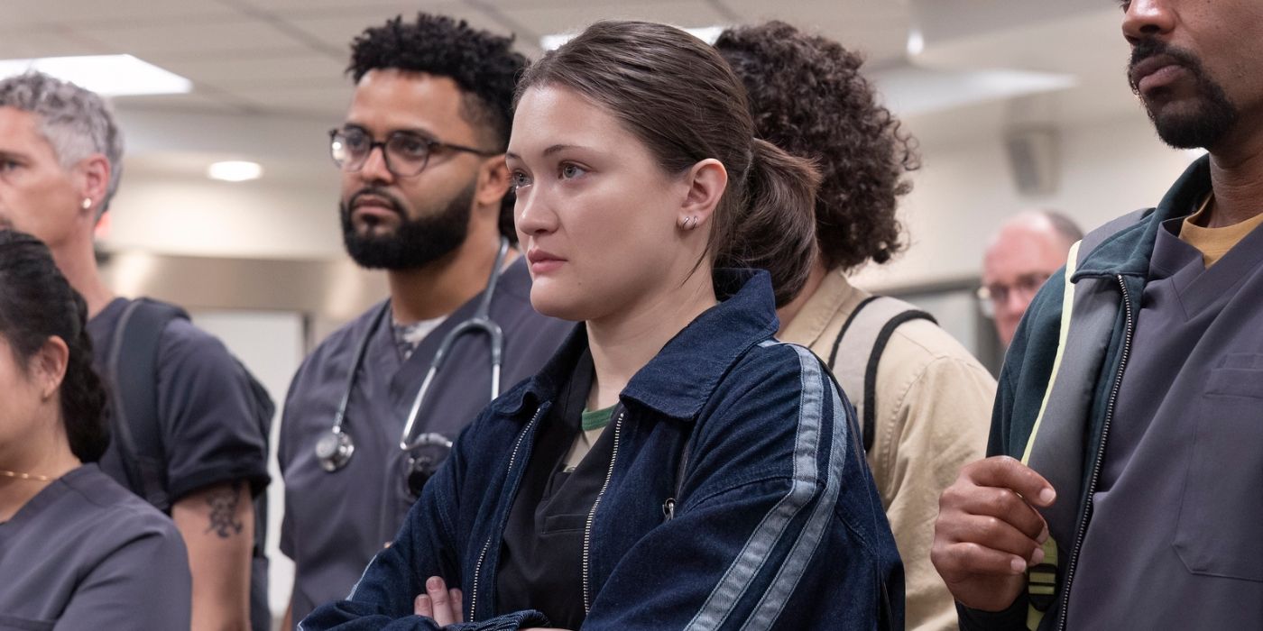 Santos (Isa Briones) standing at the front of a group of hospital staff in The Pitt Season 1 finale