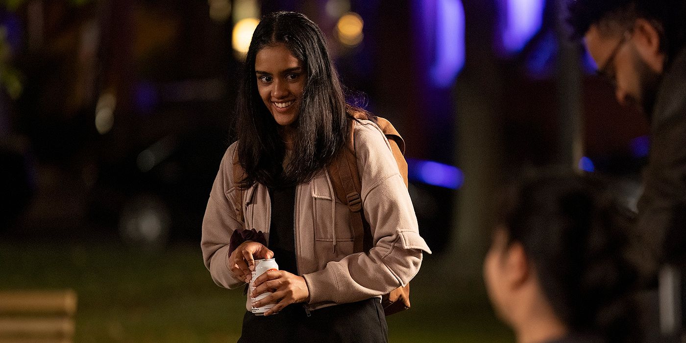 Shabana Azeez as Dr. Javadi holding a beer can and smiling in The Pitt Season 1, Episode 15.