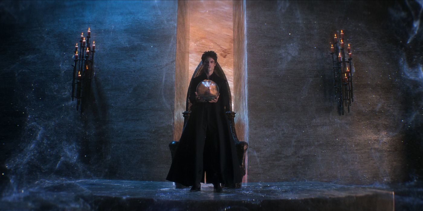 The Sandman sits on a throne and holds a glowing orb