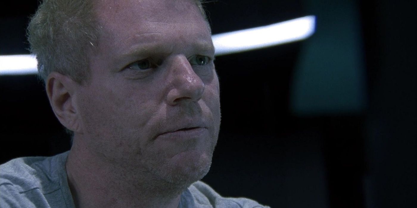 Dr. Jenner looks concerned at someone or something off-camera in The Walking Dead.