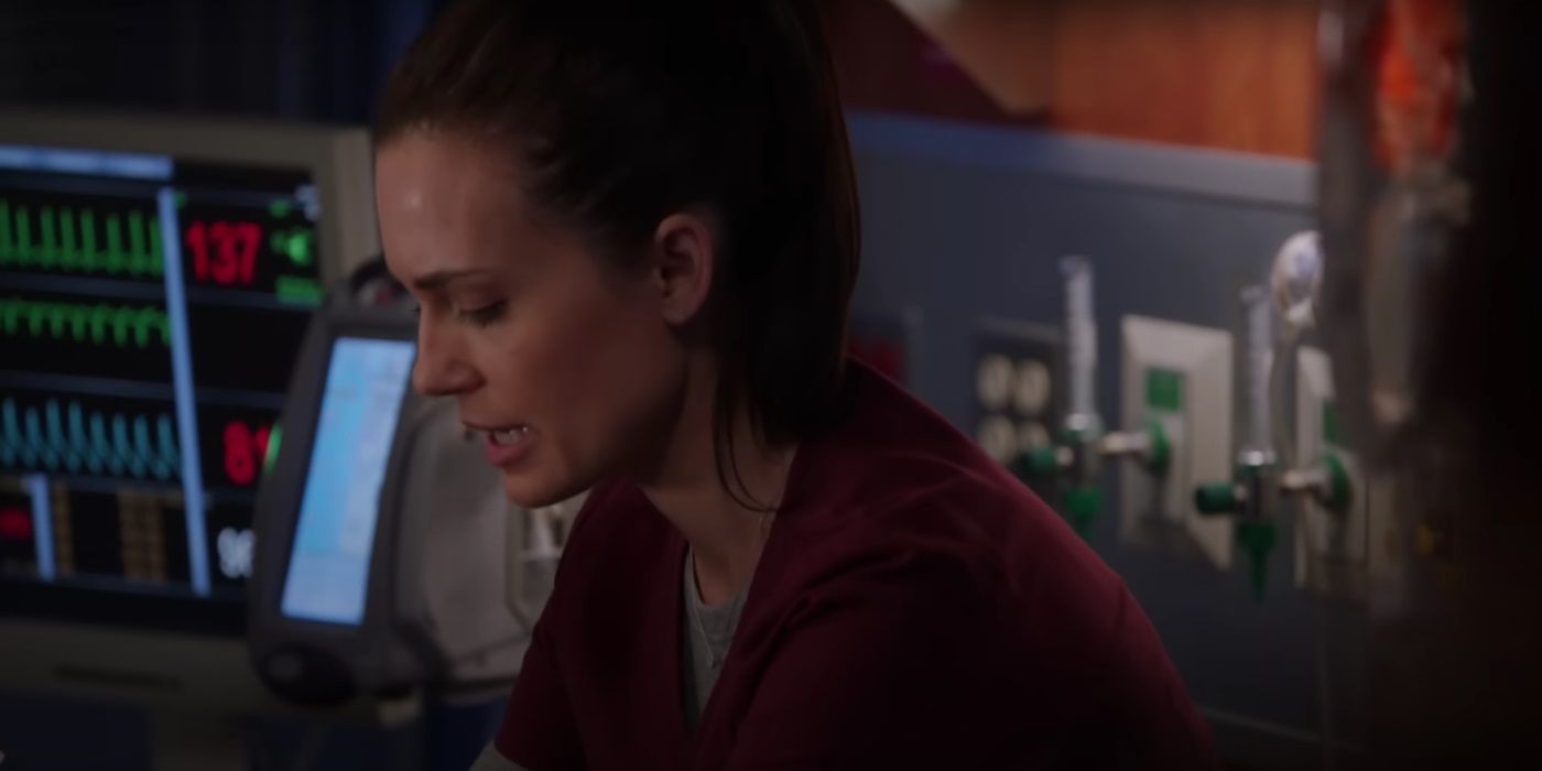 Torrey DeVitto tending to a patient as Dr. Natalie Manning in Season 3, Episode 18 This Is Now in Chicago Med.