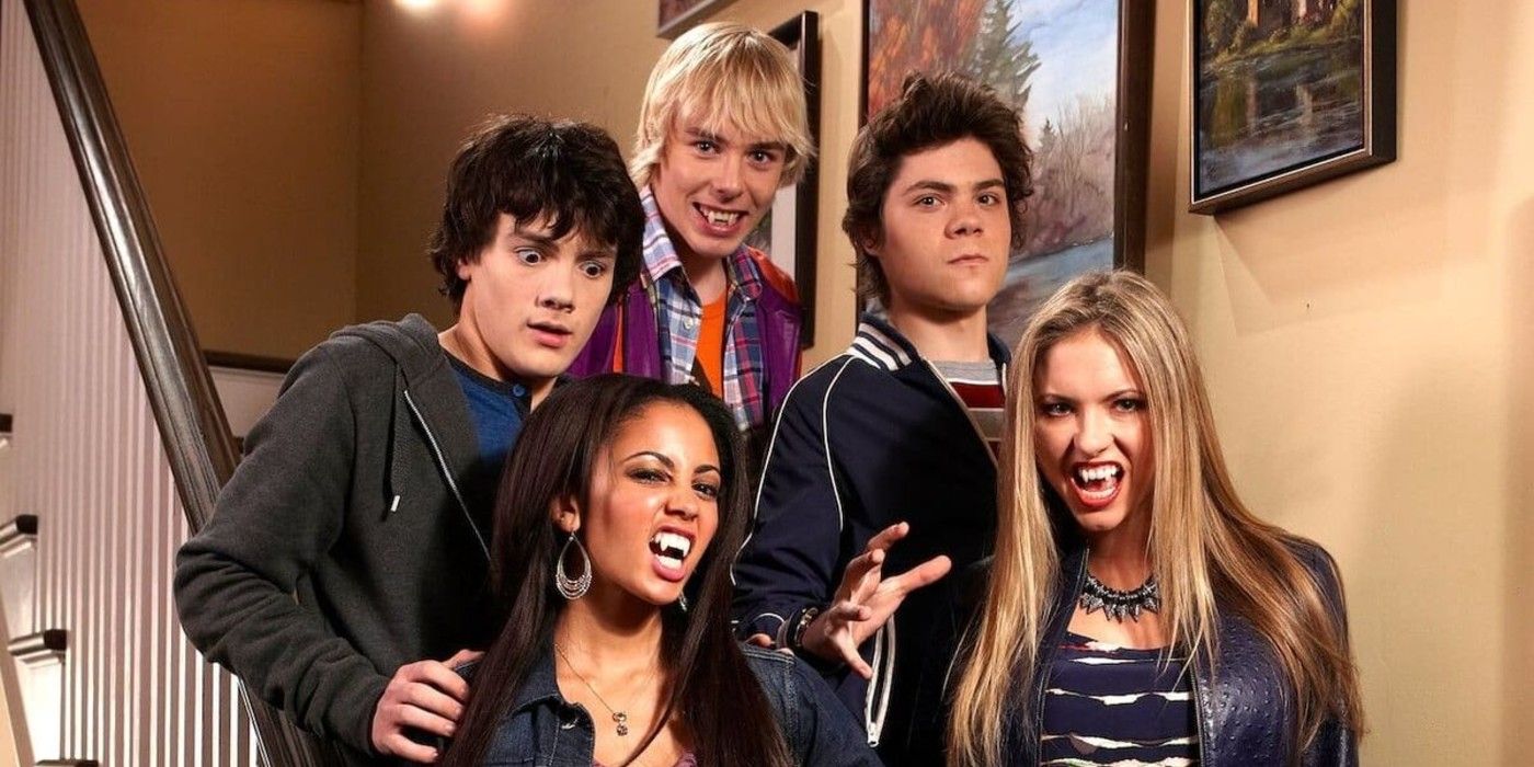 Benny, Rory, Ethan, Sarah, and Erica stand on stairs with some bearing fangs in My Babysitter&rsquo;s a Vampire.